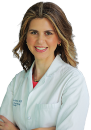 A woman in a white lab coat smiles at the camera, suggesting professionalism and trust, aligning with WeNatal's focus on prenatal health and supplements.